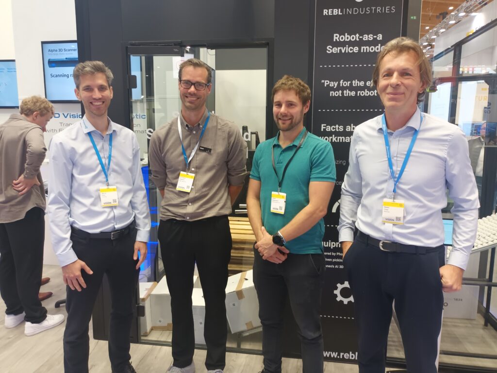 Photoneo team demostrating multiview bin-picking at Vision 2024 trade fair in Stuttgart. 